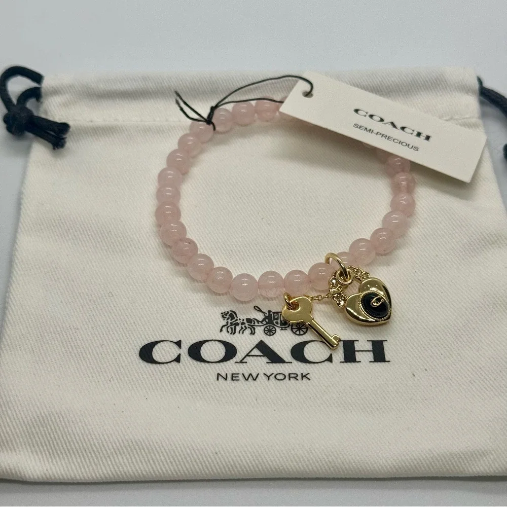 Last One Coach New Heart Key Bead Stretch Bracelet Light Pink‎ Gold Tone Chams